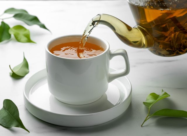 Pour Green Tea Into A Cup