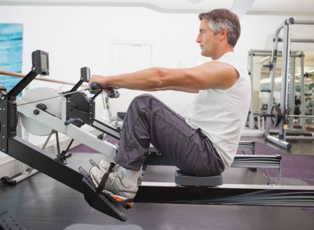 Mature Man Working Out On A Rowing Machine