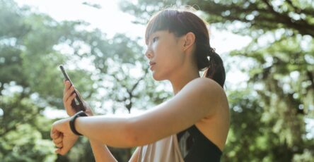 working out lady using smartphone