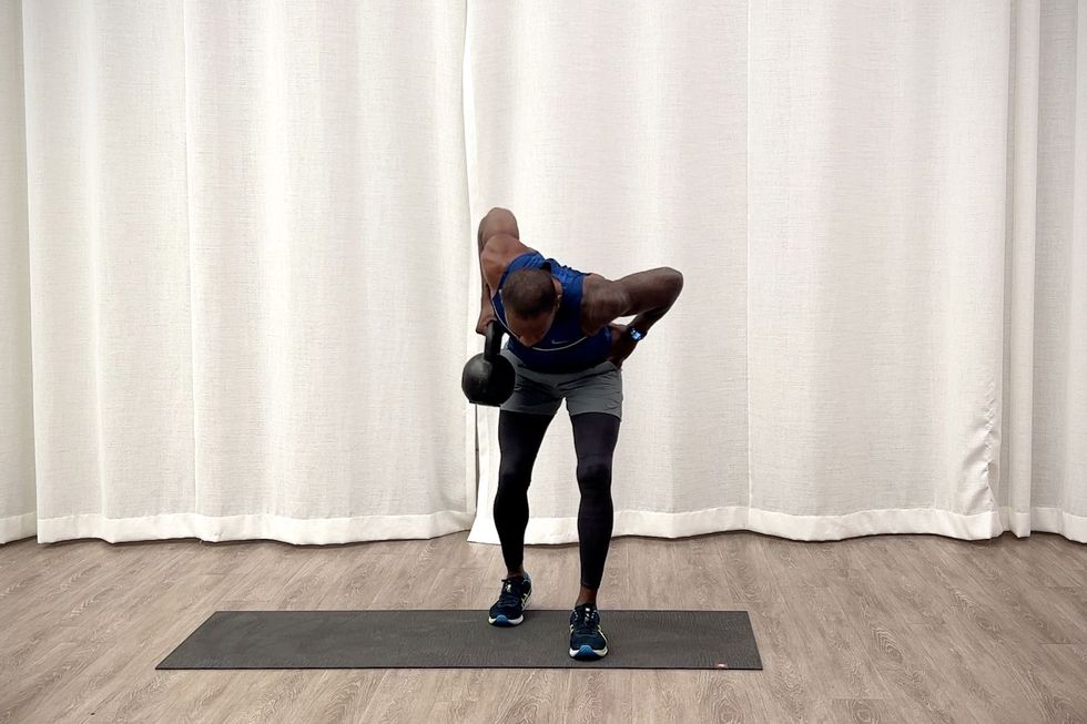 Beginner kettlebell workout, Jeffers practices deadlift in split position to bend over row exercise