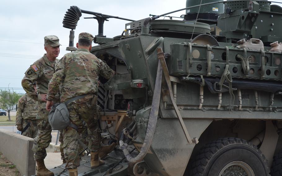 Lt. Gen. Sean Bernabe, Commander Of Iii Corps And Fort Hood, Texas, Shows Army Chief Of Staff Gen. James Mcconville The Modifications To A Stryker Armored Vehicle During A Training Exercise. Multinational Training On Thursday, April 20, 2023.