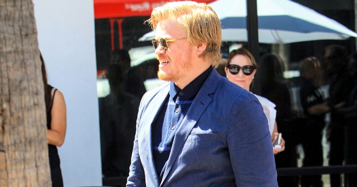 Jesse Plemons Wearing A Blue Suit Walking Outside