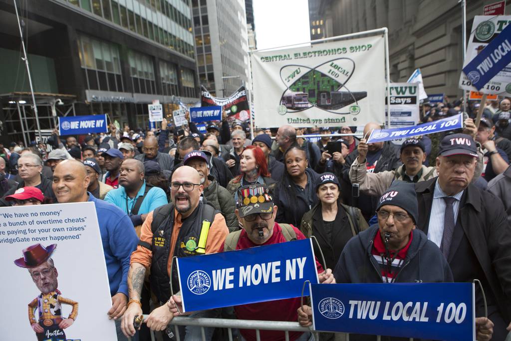 TWU 100 transit workers gather outside 2 Broadway over their ongoing contract dispute with the MTA.