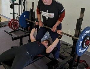 Peter Hubbard, 85, spots his wife, Nona, 61, during a recent weightlifting workout.  The two will compete in the Powerlifting America New Hampshire State Championship at Lift Free or Die Gym in Dover beginning at 9 a.m.