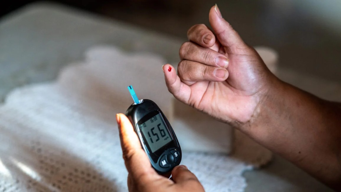 A person checks their blood sugar level.